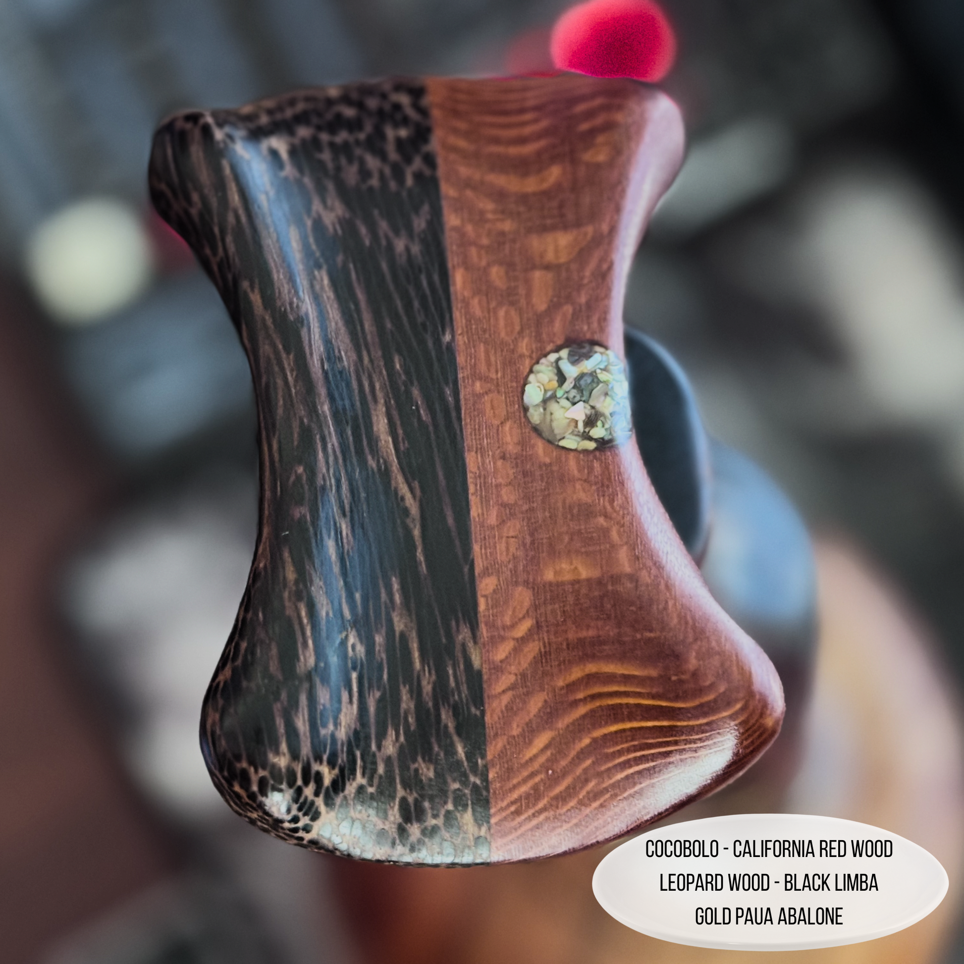 Close-up of abalone shell inlay on cocobolo headphone stand