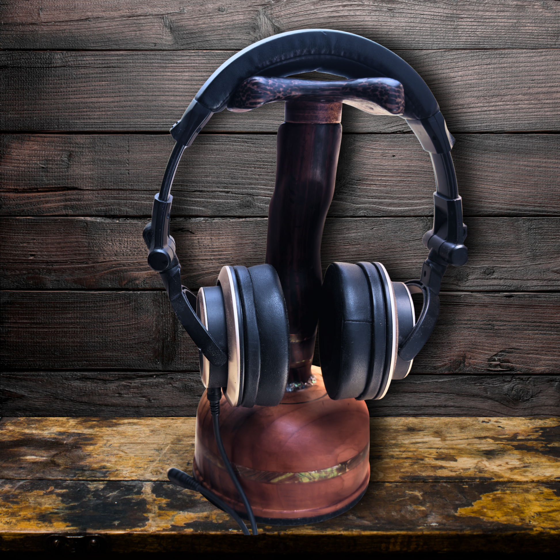 Cocobolo headphone stand displaying premium headphones