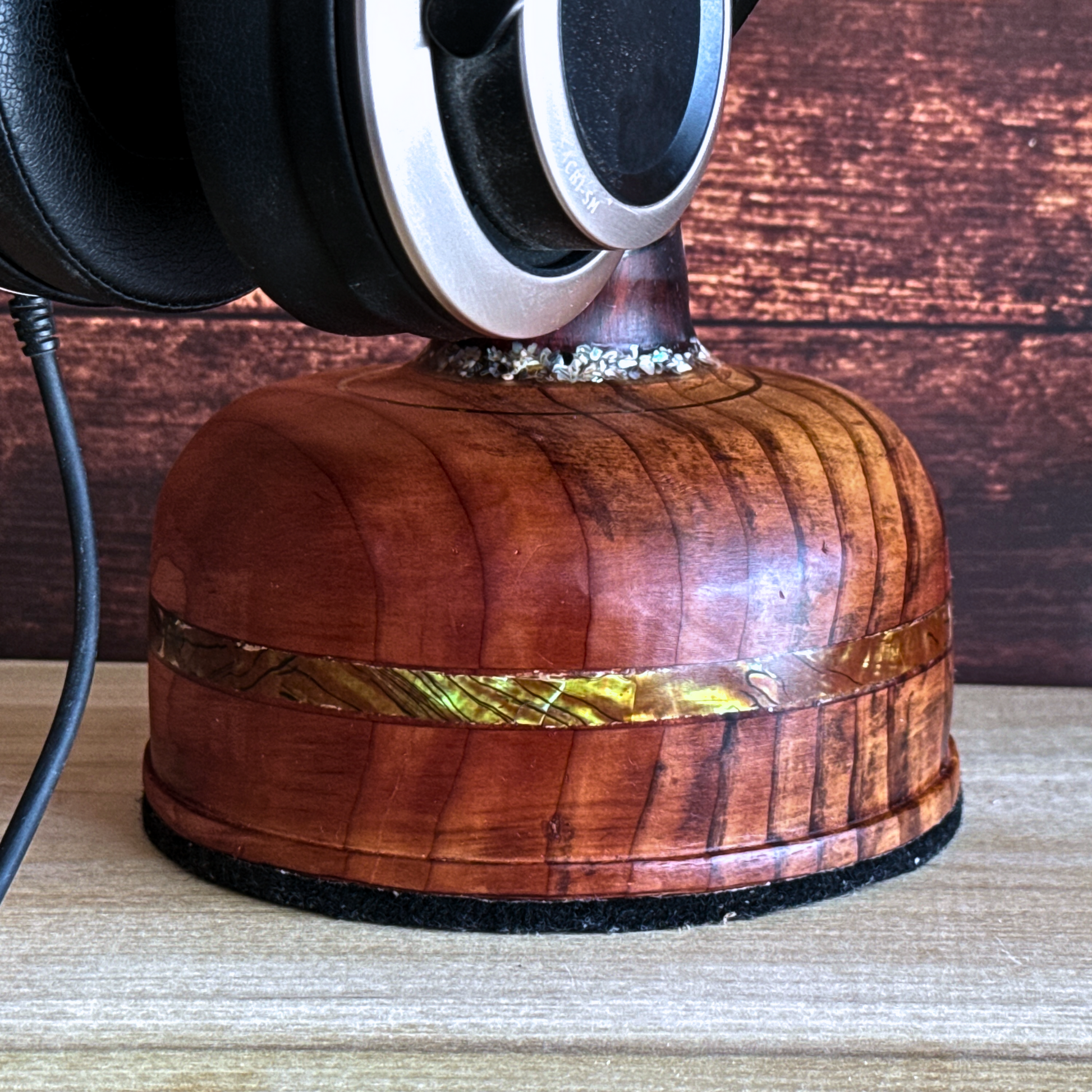 Detail of tribal design pattern on wooden headphone stand