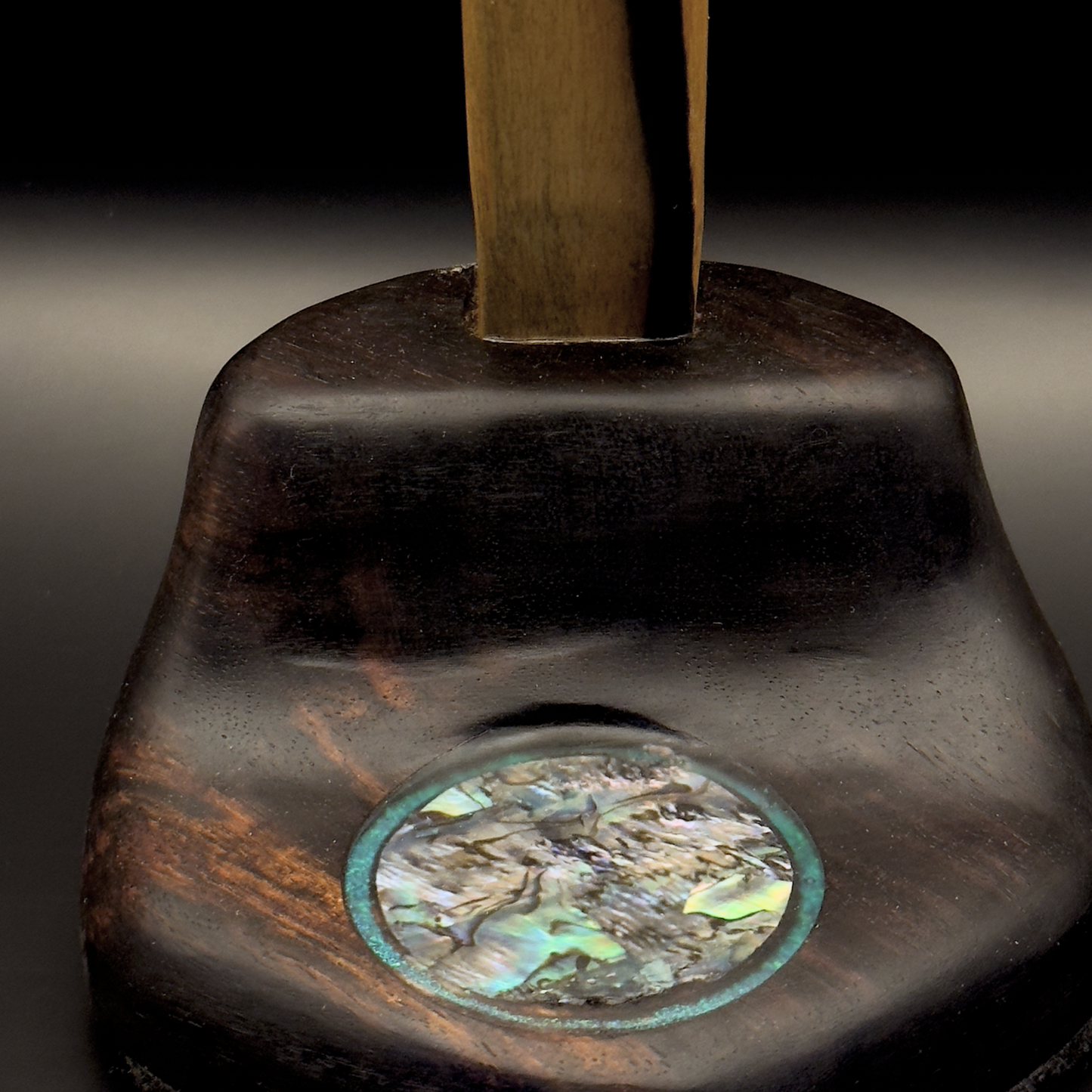 Base detail of handmade rosewood headphone stand