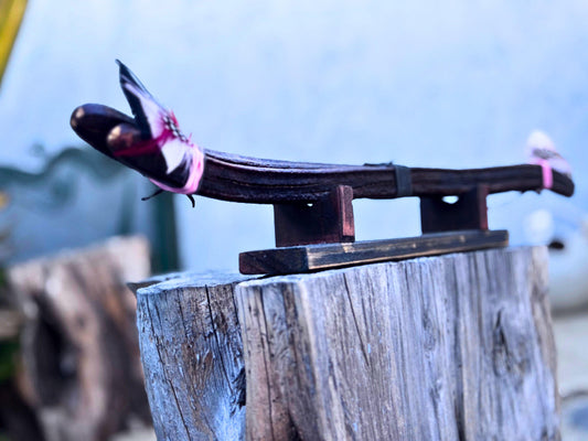 Handcrafted feather decoration on Patuá shamanic rattle #004