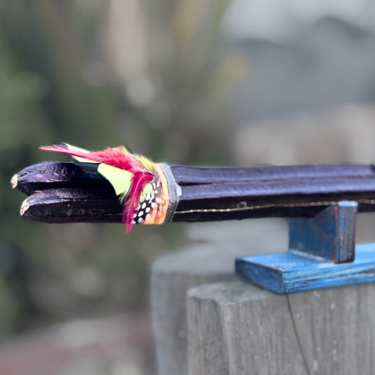Handcrafted feather decoration on Patuá shamanic rattle #009