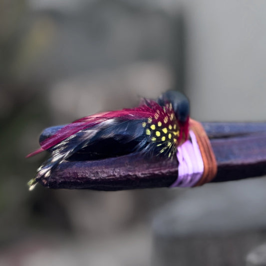 rattle #0010 showing feather detail