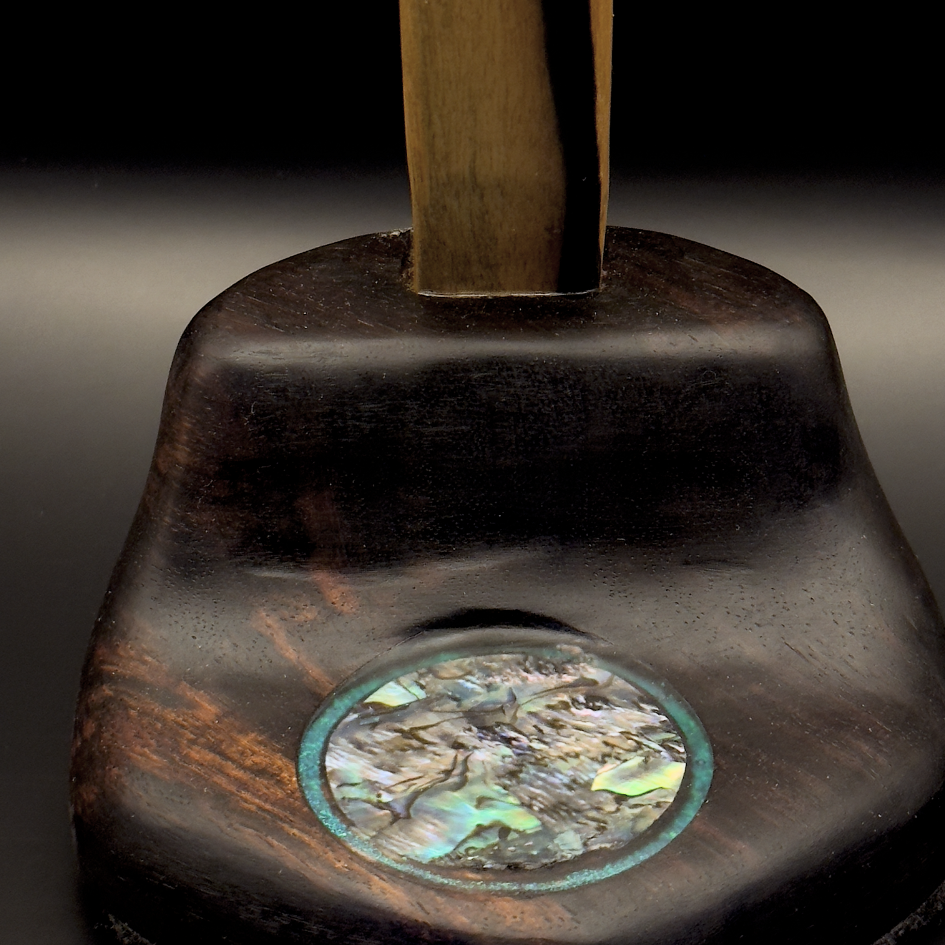 Base detail of handmade rosewood headphone stand