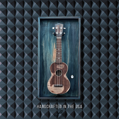 Framed ukulele with 'Handcrafted in the USA' text on a textured black background