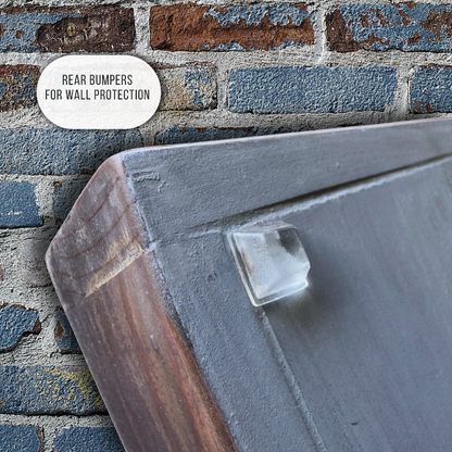 Rear bumper with wall protection feature against a brick wall background