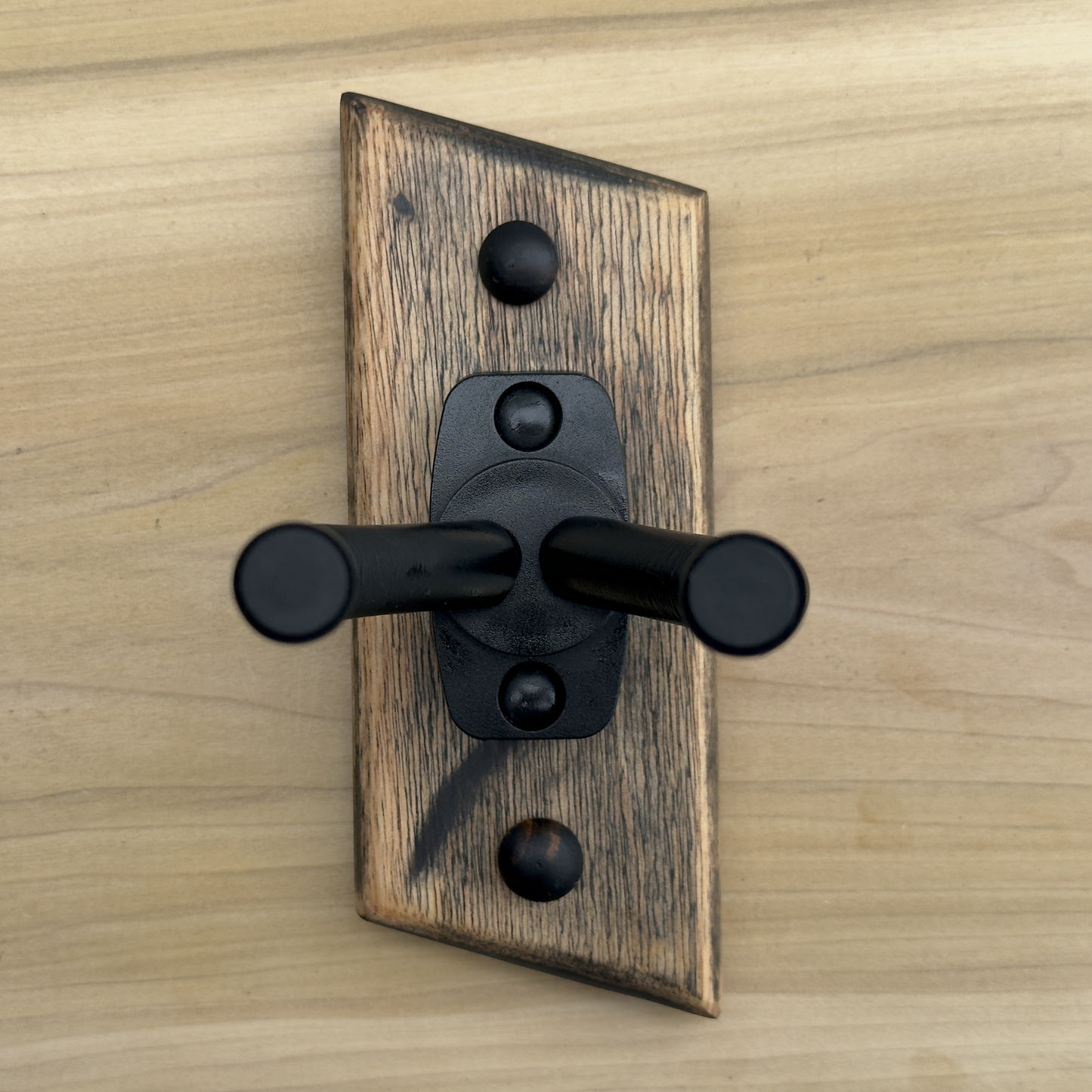 Front view of rustic guitar wall mount showing a stressed relic-like rustic  finish