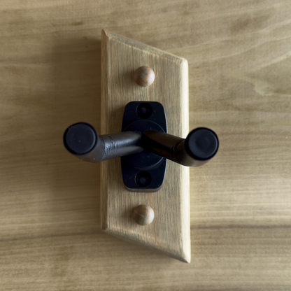 Detail of exotic wood inlay on handmade guitar wall mount