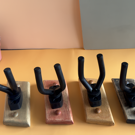 Handcrafting process of wooden guitar wall mount showing artisan techniques