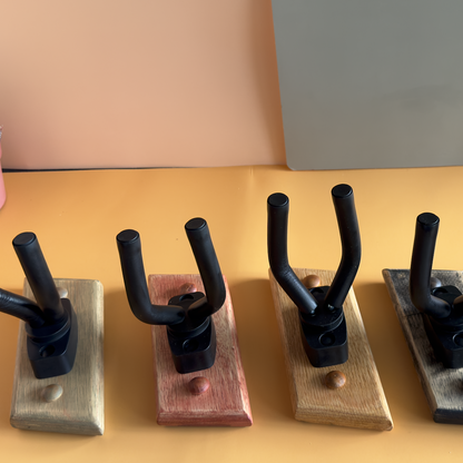 Handcrafting process of wooden guitar wall mount showing artisan techniques